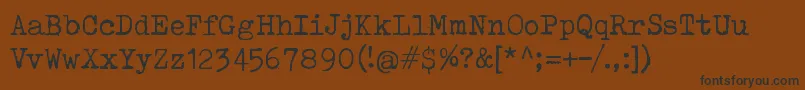 ToxTypewriter Font – Black Fonts on Brown Background