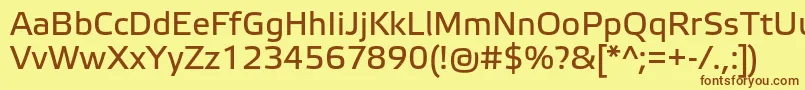 フォントElektraTextPro – 茶色の文字が黄色の背景にあります。