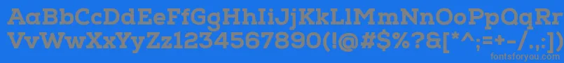 NexaSlabHeavy-fontti – harmaat kirjasimet sinisellä taustalla