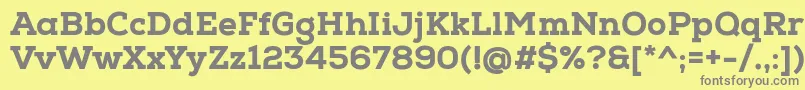 NexaSlabHeavy-fontti – harmaat kirjasimet keltaisella taustalla