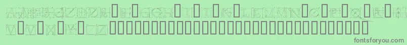 Duererlatinconstructioncapitals-fontti – harmaat kirjasimet vihreällä taustalla
