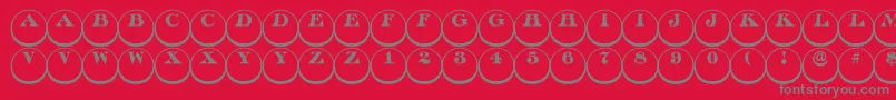 Fonte Discoserifdn3DRegular – fontes cinzas em um fundo vermelho