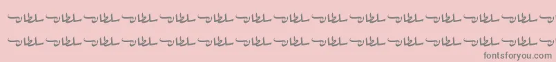 フォントSultanFree – ピンクの背景に灰色の文字