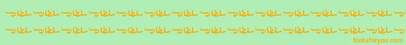 フォントSultanFree – オレンジの文字が緑の背景にあります。