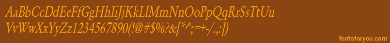 フォントYearlindNormalCondensedItalic – オレンジ色の文字が茶色の背景にあります。