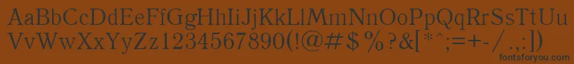 Quantantiquactt-Schriftart – Schwarze Schriften auf braunem Hintergrund
