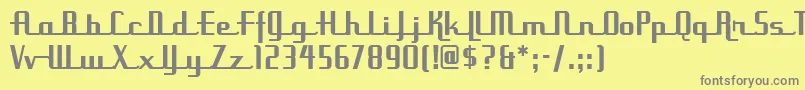 UppenarmsnfMedium-fontti – harmaat kirjasimet keltaisella taustalla