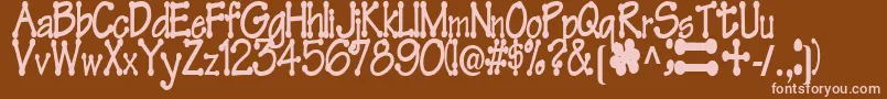 FeltRegularTtstd Font – Pink Fonts on Brown Background