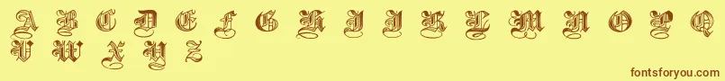 フォントHalftone – 茶色の文字が黄色の背景にあります。
