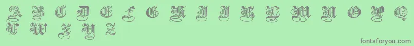 Halftone-fontti – harmaat kirjasimet vihreällä taustalla