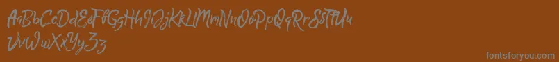 Шрифт QuickSilverDemo – серые шрифты на коричневом фоне