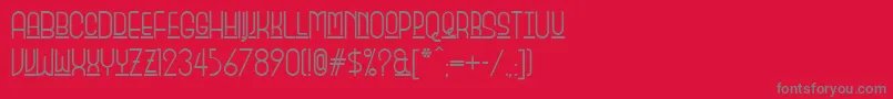 フォントMonicas – 赤い背景に灰色の文字