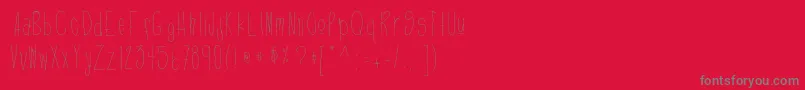 フォントDefygravity – 赤い背景に灰色の文字