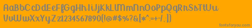BmdUptownMarketUpright-Schriftart – Graue Schriften auf orangefarbenem Hintergrund