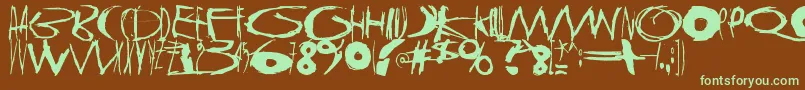 フォントTasapainoaistiHuimaus – 緑色の文字が茶色の背景にあります。