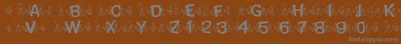 MtfBaseLeafy Font – Gray Fonts on Brown Background