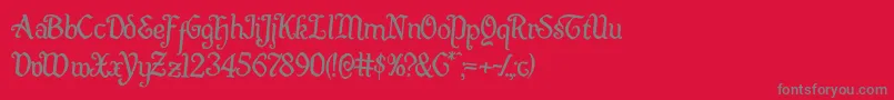 Quillswordrotate2-Schriftart – Graue Schriften auf rotem Hintergrund