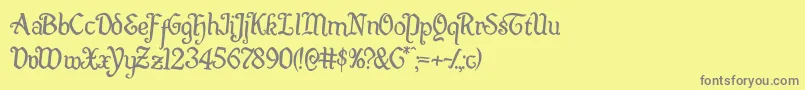 フォントQuillswordrotate2 – 黄色の背景に灰色の文字