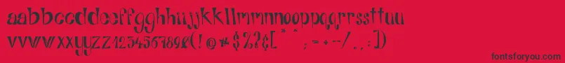 フォントAlphabitsRegular – 赤い背景に黒い文字