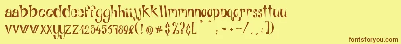 Шрифт AlphabitsRegular – коричневые шрифты на жёлтом фоне