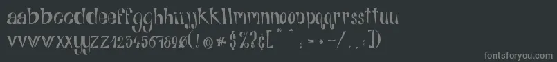 Fonte AlphabitsRegular – fontes cinzas em um fundo preto