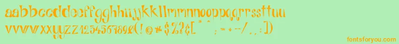 フォントAlphabitsRegular – オレンジの文字が緑の背景にあります。