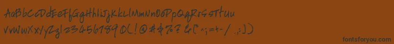 HandscriptuprightBold-Schriftart – Schwarze Schriften auf braunem Hintergrund