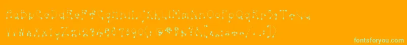 Skinnydrip-Schriftart – Grüne Schriften auf orangefarbenem Hintergrund