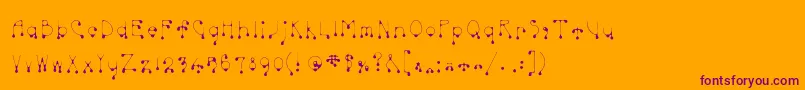 Skinnydrip-Schriftart – Violette Schriften auf orangefarbenem Hintergrund