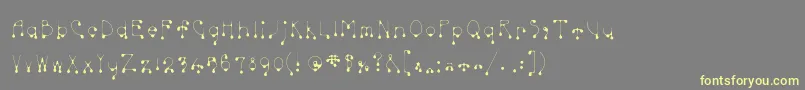 Skinnydrip Font – Yellow Fonts on Gray Background