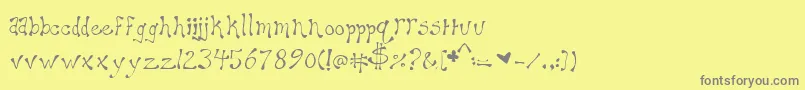 フォントMaryellen – 黄色の背景に灰色の文字