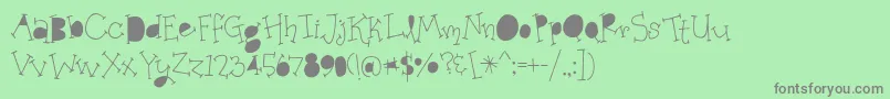 OrganicFridaysSolidAlternates-Schriftart – Graue Schriften auf grünem Hintergrund