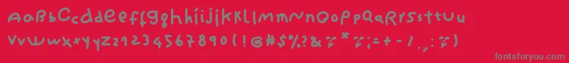 CantikaCuteHandwriting-fontti – harmaat kirjasimet punaisella taustalla
