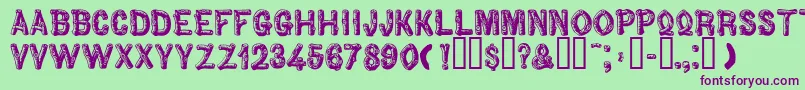 Woodbadge Font – Purple Fonts on Green Background