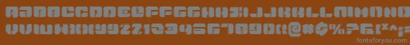 DanStargatePro-fontti – harmaat kirjasimet ruskealla taustalla