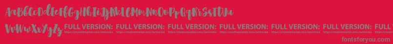 Shrewdy Font – Gray Fonts on Red Background