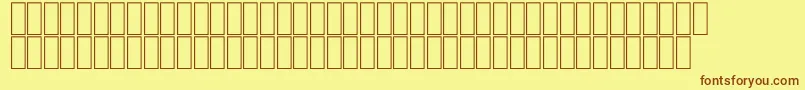 フォントFsWood – 茶色の文字が黄色の背景にあります。