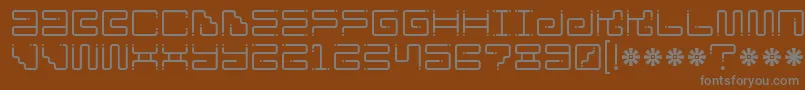 Ironloungedots-Schriftart – Graue Schriften auf braunem Hintergrund