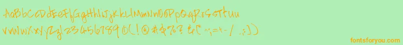 フォントHandscriptleftyRegular – オレンジの文字が緑の背景にあります。