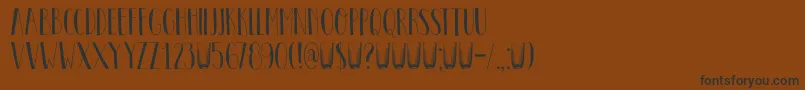 Więcej informacji o czcionce DkPastis Czcionka DkPastis – czarne czcionki na brązowym tle