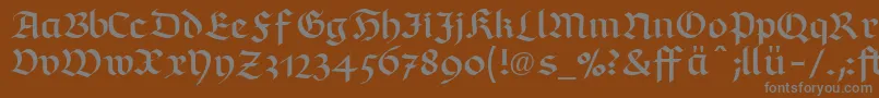 RichmondfrakturLtDfr-fontti – harmaat kirjasimet ruskealla taustalla