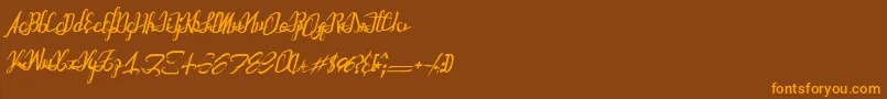 フォントAstralprojectionsitalic – オレンジ色の文字が茶色の背景にあります。