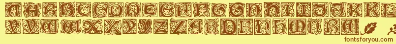 MorrisJensonInitialen-fontti – ruskeat fontit keltaisella taustalla