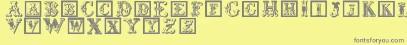 Corrodetinitials-fontti – harmaat kirjasimet keltaisella taustalla