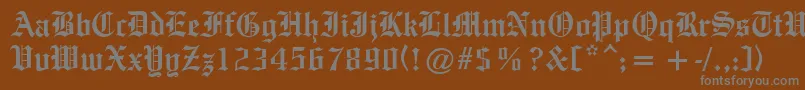 OldeEnglishe Font – Gray Fonts on Brown Background