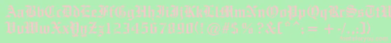 OldeEnglishe-fontti – vaaleanpunaiset fontit vihreällä taustalla