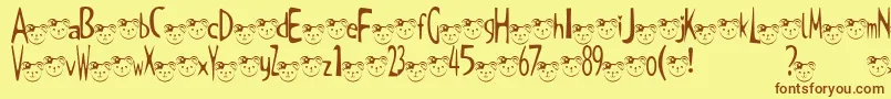 TKuma2Font Font – Brown Fonts on Yellow Background