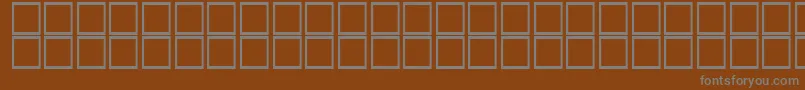 KhalaadAlDorrh-Schriftart – Graue Schriften auf braunem Hintergrund