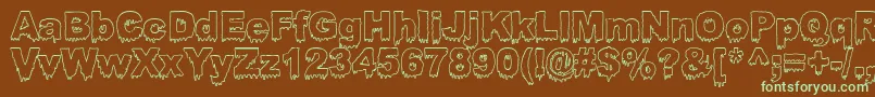 フォントBloosg – 緑色の文字が茶色の背景にあります。