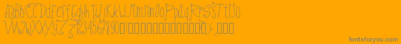 Pwfairytales-fontti – harmaat kirjasimet oranssilla taustalla